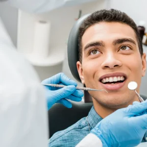 Young man receiving a dental checkup at a Danforth dental office